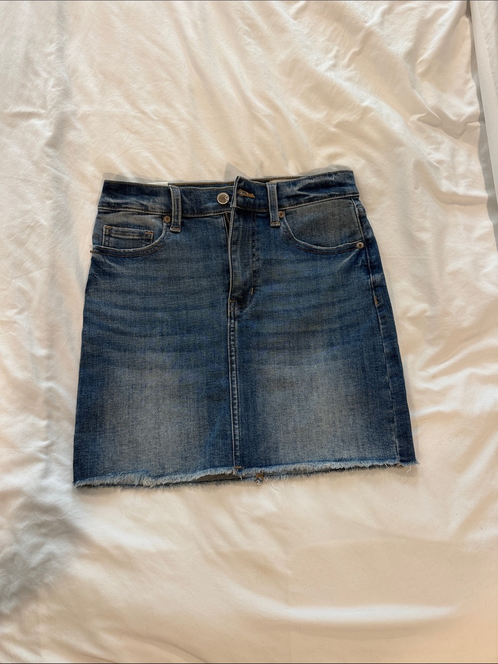 Women's Washed Blue Denim Mini Skirt with Raw Hem